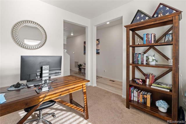 office space with light hardwood / wood-style floors