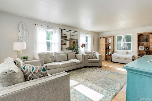 5332 W Roxbury Pl, Littleton, CO 80128 - living room featuring plenty of natural light and wood finished floors