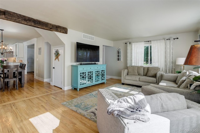 5332 W Roxbury Pl, Littleton, CO 80128 - living area featuring a chandelier, light wood finished floors, and baseboards