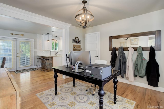 5332 W Roxbury Pl, Littleton, CO 80128 - office space with light wood finished floors, a chandelier, and french doors
