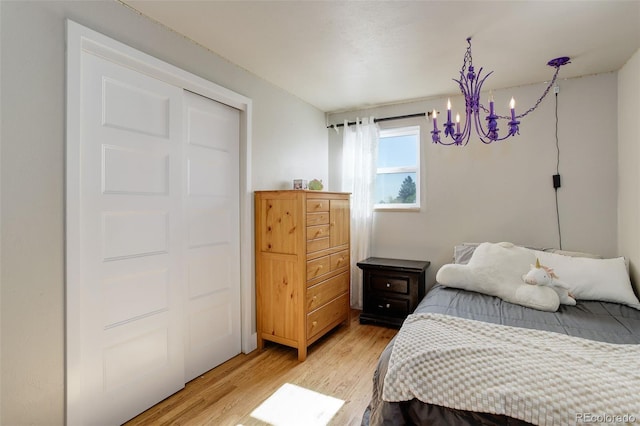 5332 W Roxbury Pl, Littleton, CO 80128 - bedroom featuring a chandelier and light wood-type flooring