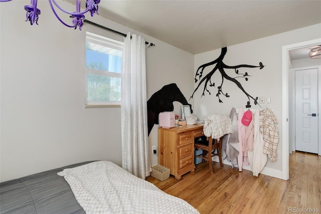 5332 W Roxbury Pl, Littleton, CO 80128 - bedroom featuring light wood finished floors and baseboards