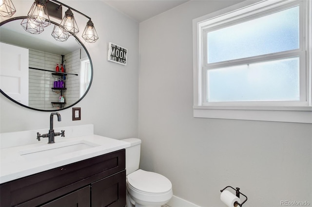 5332 W Roxbury Pl, Littleton, CO 80128 - bathroom with vanity, toilet, and baseboards