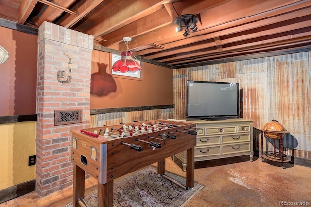 5332 W Roxbury Pl, Littleton, CO 80128 - playroom featuring wainscoting, concrete flooring, and wood walls