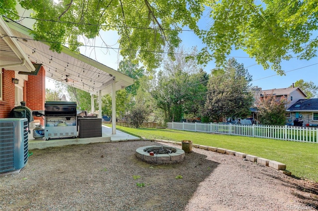 5332 W Roxbury Pl, Littleton, CO 80128 - view of yard with a patio, ceiling fan, an outdoor fire pit, central AC, and a hot tub