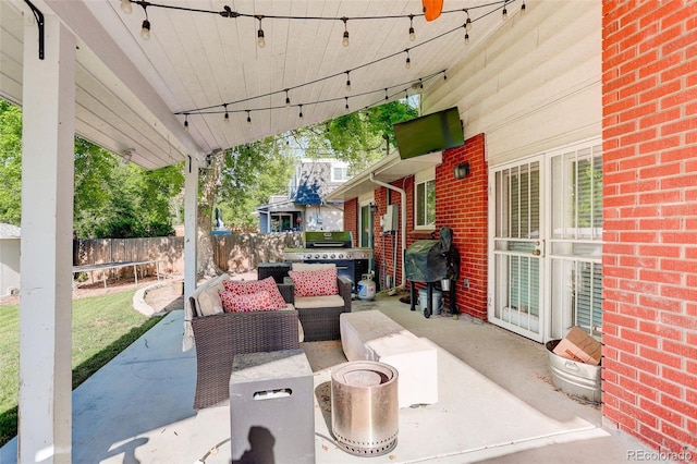 5332 W Roxbury Pl, Littleton, CO 80128 - view of patio with area for grilling, an outdoor living space, and a trampoline