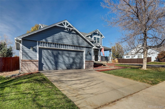 view of front of house featuring a front lawn and a garage