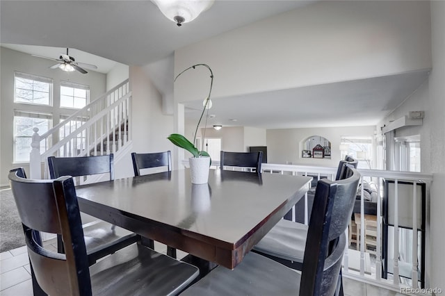 tiled dining area with ceiling fan