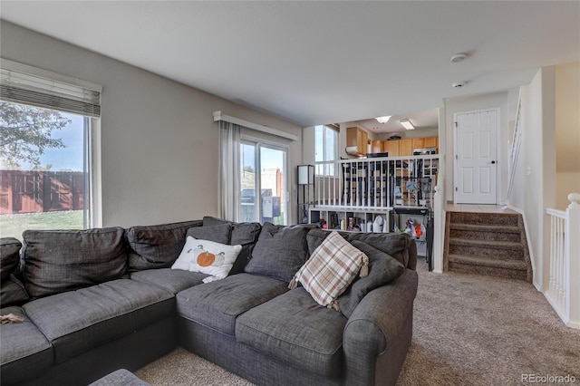 living room featuring light carpet