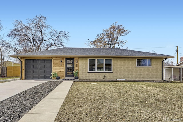 ranch-style home featuring a garage, a shingled roof, concrete driveway, a front lawn, and brick siding