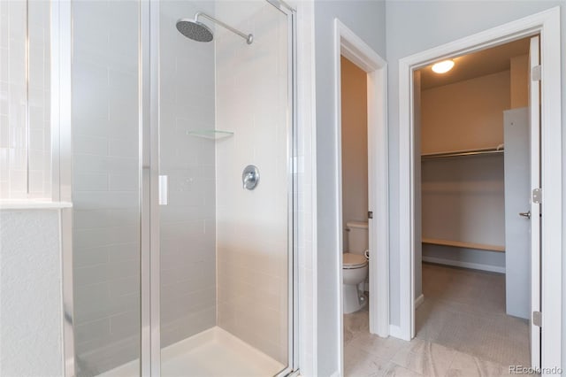15443 W 65th Ave Unit B, Arvada, CO 80007 - full bathroom with a stall shower and a walk in closet
