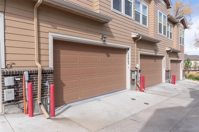 15443 W 65th Ave Unit B, Arvada, CO 80007 - garage with driveway