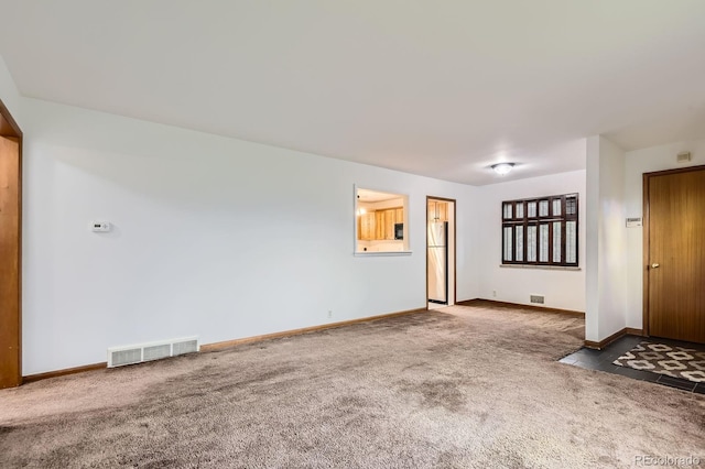 5370 S Sherman St, Littleton, CO 80121 - unfurnished living room with carpet flooring and baseboards