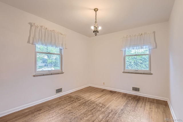 5370 S Sherman St, Littleton, CO 80121 - spare room featuring baseboards and wood finished floors
