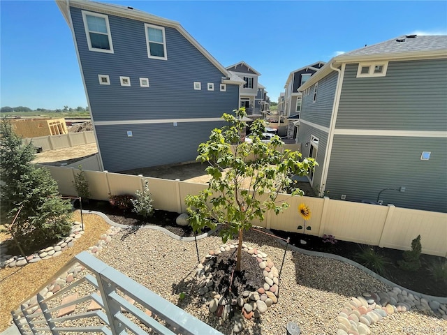 view of side of home featuring a fenced backyard