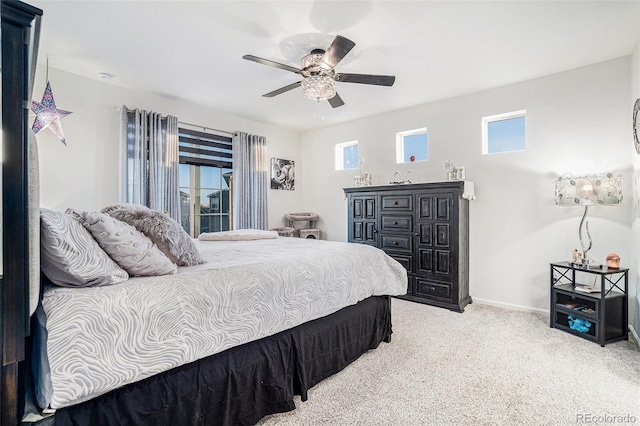 bedroom with baseboards, carpet floors, and a ceiling fan