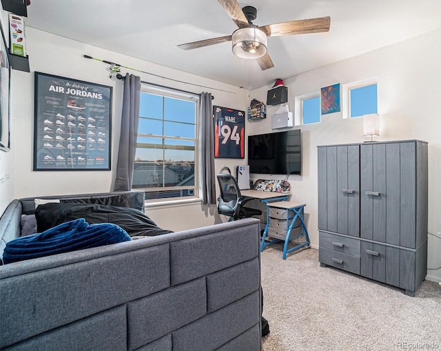 living room featuring carpet and ceiling fan