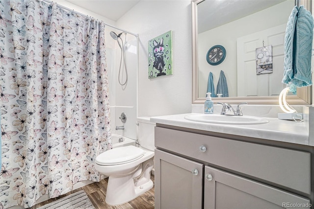 full bath with vanity, shower / bathtub combination with curtain, toilet, and wood finished floors