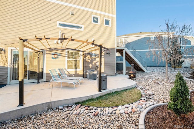 back of property with a patio and a pergola