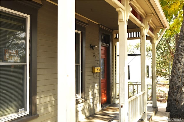 property entrance with covered porch