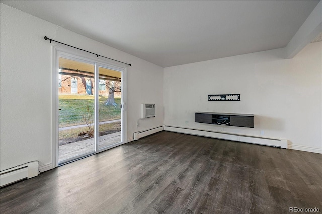 unfurnished living room with a baseboard radiator, a wall mounted air conditioner, and wood finished floors