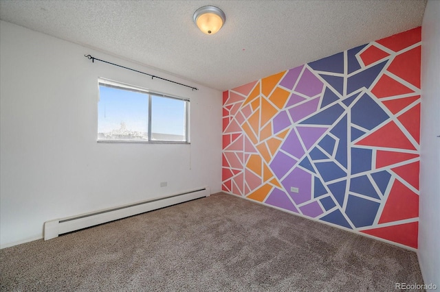 empty room featuring a textured ceiling, an accent wall, baseboard heating, and carpet flooring