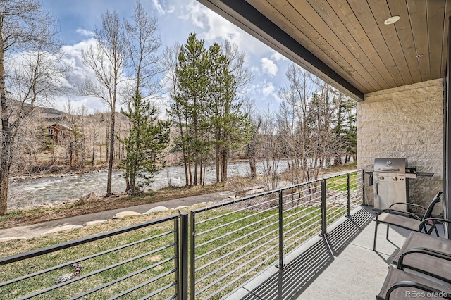 930 Blue River Pkwy Unit 812, Silverthorne, CO 80498 - balcony featuring a water view and area for grilling