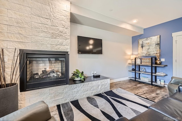 930 Blue River Pkwy Unit 812, Silverthorne, CO 80498 - living room with baseboards, wood finished floors, and a fireplace