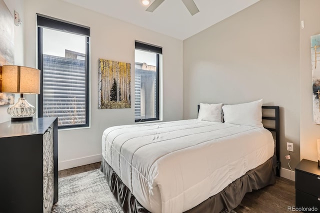 930 Blue River Pkwy Unit 812, Silverthorne, CO 80498 - bedroom with baseboards, a ceiling fan, and wood finished floors