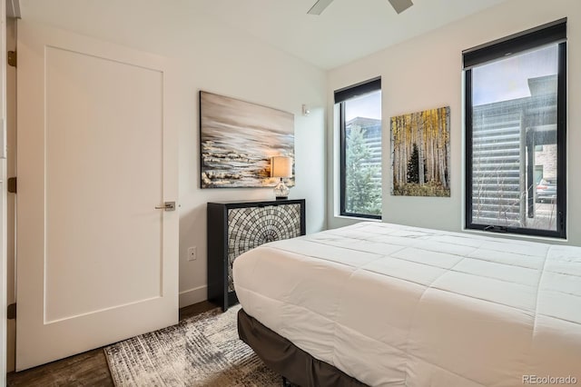 930 Blue River Pkwy Unit 812, Silverthorne, CO 80498 - bedroom with baseboards, a ceiling fan, and wood finished floors