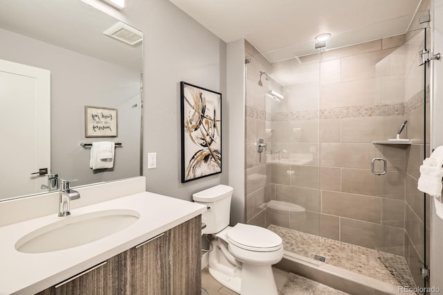 930 Blue River Pkwy Unit 812, Silverthorne, CO 80498 - bathroom with tile patterned flooring, vanity, toilet, visible vents, and a stall shower