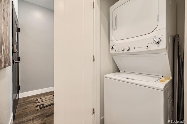 930 Blue River Pkwy Unit 812, Silverthorne, CO 80498 - washroom featuring baseboards, laundry area, wood finished floors, and stacked washer / dryer