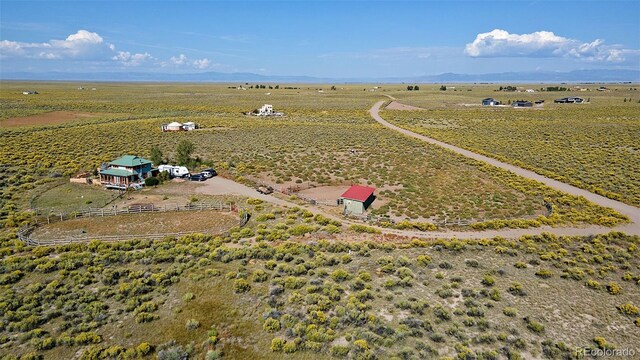 birds eye view of property featuring a rural view