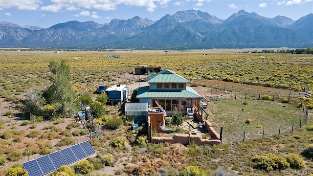 birds eye view of property with a rural view and a mountain view