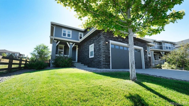 view of front of property with a garage and a front yard