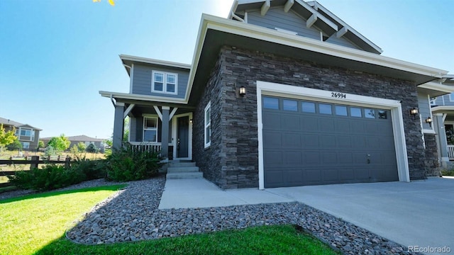 craftsman house featuring a garage and covered porch