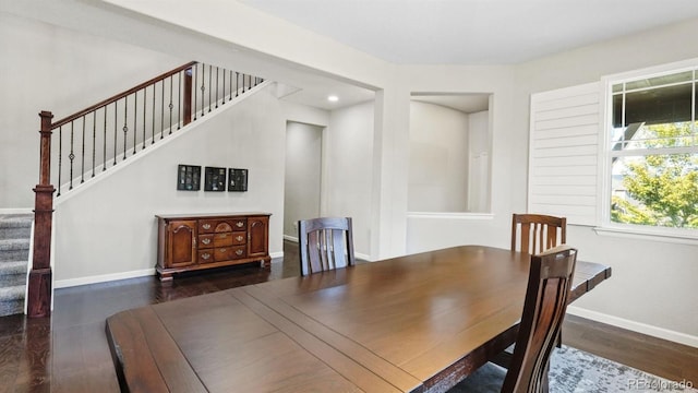 dining area with dark hardwood / wood-style flooring