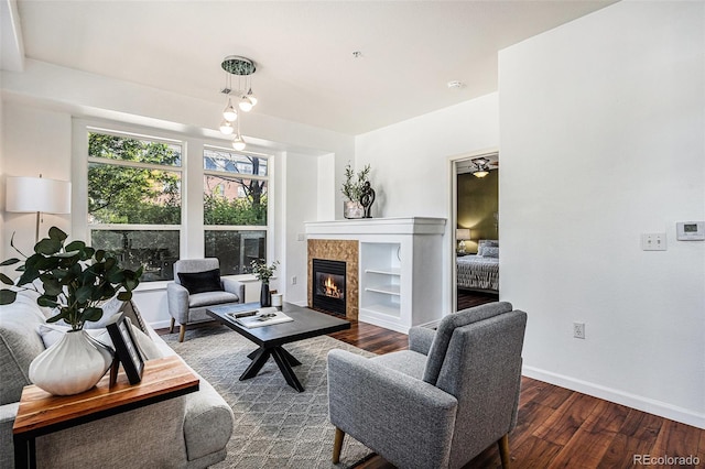 10184 Park Meadows Dr Unit 1102, Lone Tree, CO 80124 - living room featuring wood finished floors, a fireplace, and baseboards