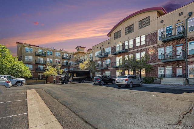 10184 Park Meadows Dr Unit 1102, Lone Tree, CO 80124 - property at dusk featuring uncovered parking