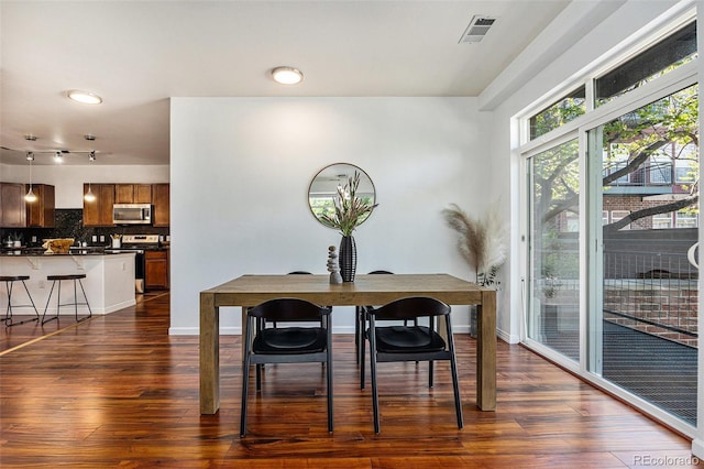 10184 Park Meadows Dr Unit 1102, Lone Tree, CO 80124 - dining room featuring dark wood finished floors and baseboards