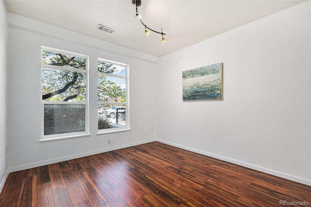 10184 Park Meadows Dr Unit 1102, Lone Tree, CO 80124 - spare room with baseboards, dark wood finished floors, and rail lighting