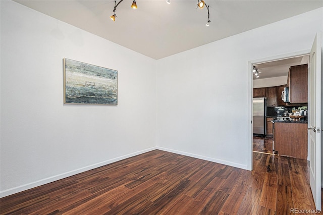 10184 Park Meadows Dr Unit 1102, Lone Tree, CO 80124 - empty room featuring dark wood finished floors and baseboards