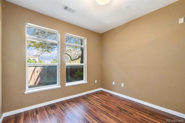 10184 Park Meadows Dr Unit 1102, Lone Tree, CO 80124 - spare room with dark wood-style floors and baseboards