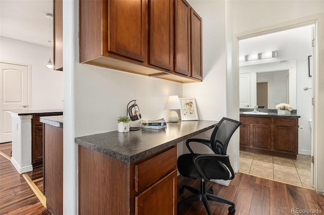 10184 Park Meadows Dr Unit 1102, Lone Tree, CO 80124 - office space with dark wood-type flooring, built in desk, and a sink