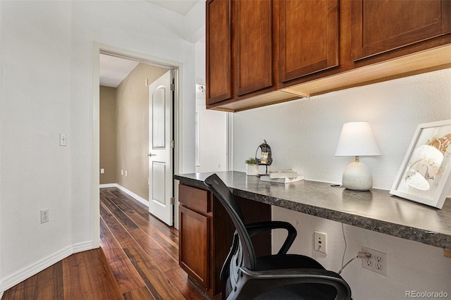 10184 Park Meadows Dr Unit 1102, Lone Tree, CO 80124 - office with built in study area, dark wood-style flooring, and baseboards