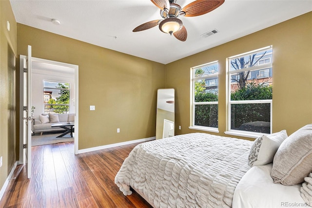 10184 Park Meadows Dr Unit 1102, Lone Tree, CO 80124 - bedroom with dark wood-style flooring, baseboards, and a ceiling fan