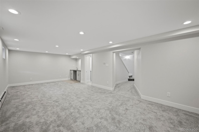 basement featuring light carpet