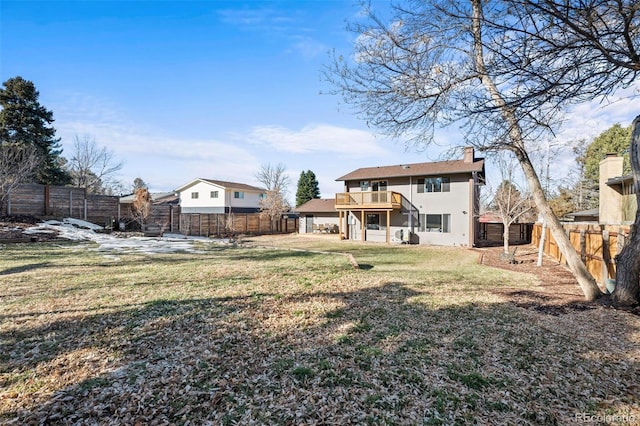 back of property featuring a lawn and a balcony