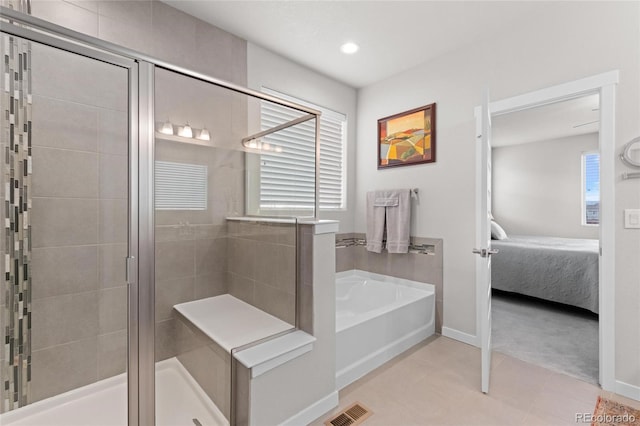 bathroom featuring tile patterned floors and plus walk in shower