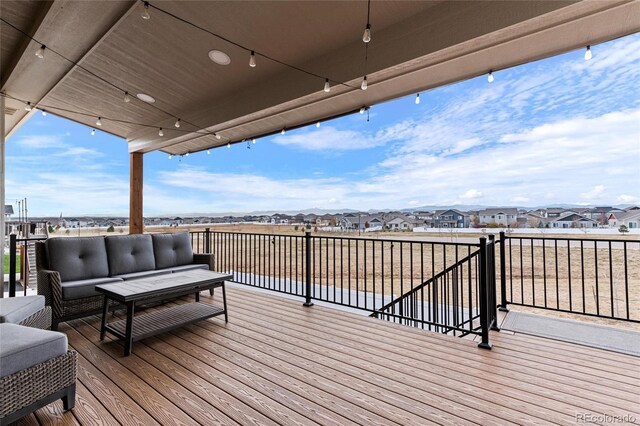 wooden deck featuring an outdoor hangout area